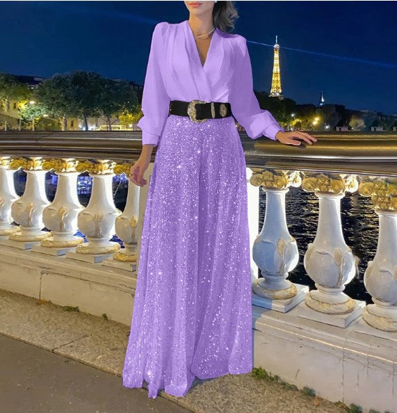 Elegantna bluza z dolgimi rokavi in V-izrezom ter široke hlače z bleščicami