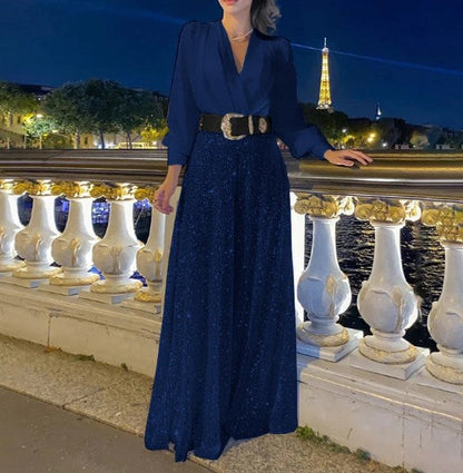 Elegantna bluza z dolgimi rokavi in V-izrezom ter široke hlače z bleščicami