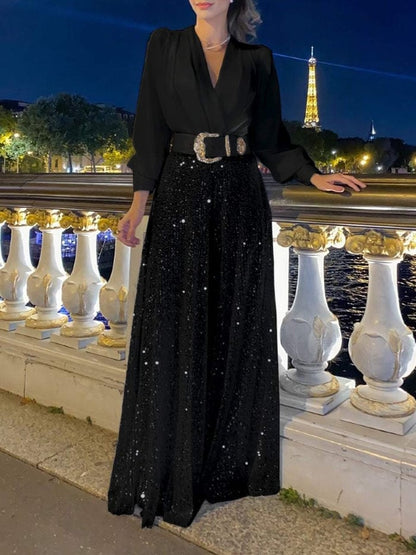 Elegantna bluza z dolgimi rokavi in V-izrezom ter široke hlače z bleščicami
